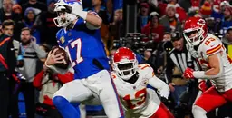 Buffalo Bills quarterback scrambles as Kansas City Chiefs defenders pursue in NFL matchup.