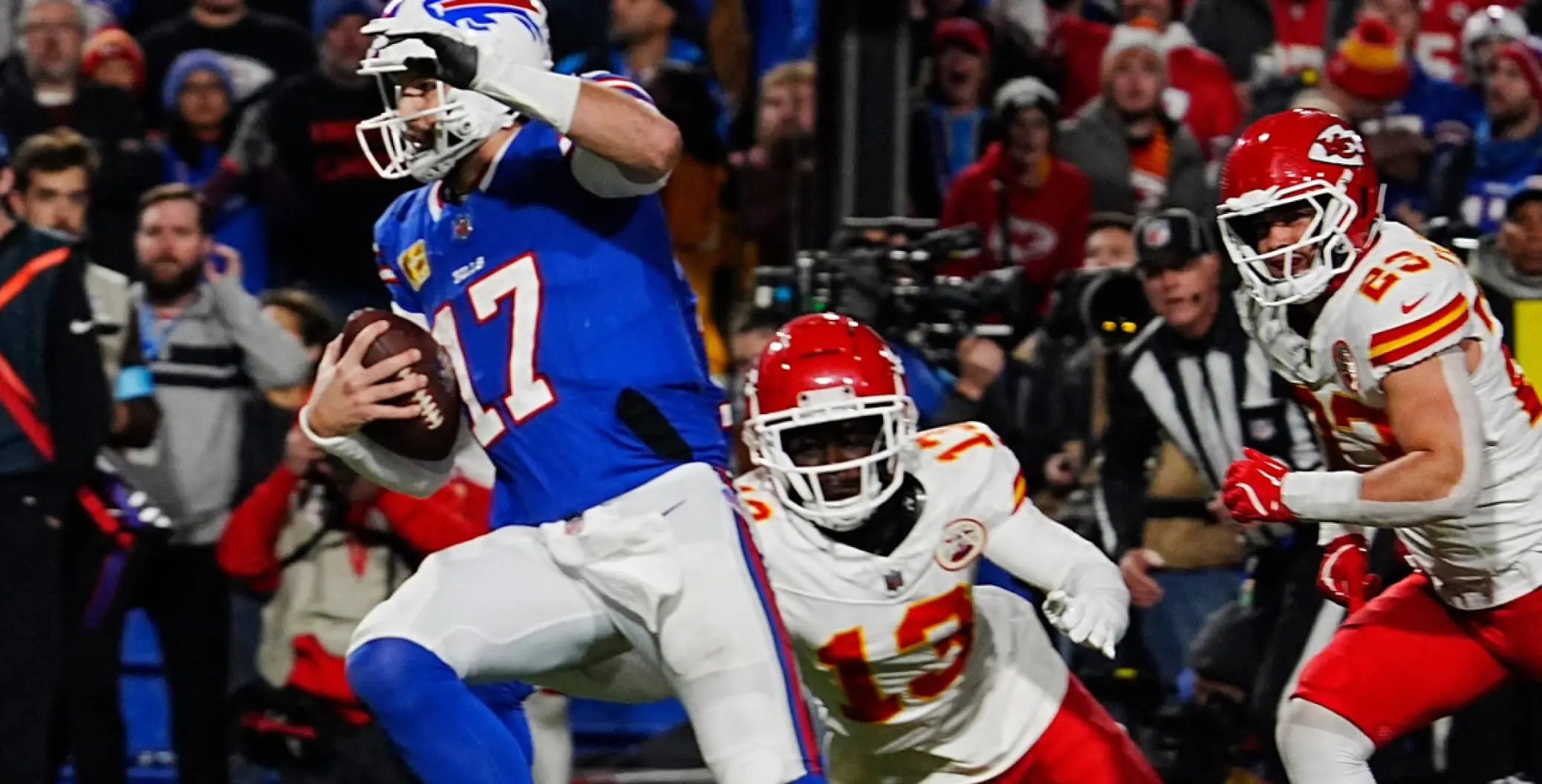 Buffalo Bills quarterback scrambles as Kansas City Chiefs defenders pursue in NFL matchup.