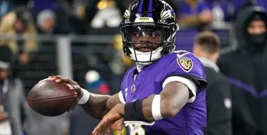 Baltimore Ravens quarterback Lamar Jackson warming up for NFL game