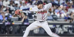 Atlanta Braves pitcher delivering a pitch during a game against the Philadelphia Phillies