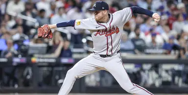 Atlanta Braves pitcher delivering a pitch during a game against the Philadelphia Phillies