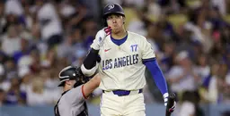 Los Angeles Dodgers baseball player at bat during game against San Francisco Giants.