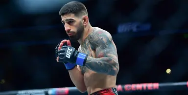 Topuria in fighting stance inside the octagon